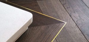 17. Lyon herringbone flooring with border and brass inlay